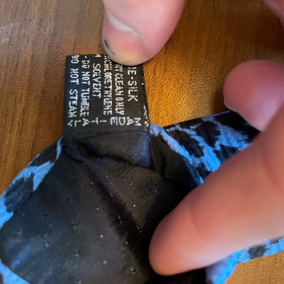 Blue Gianni Versace tie with Gold Cupid pattern. - Picture 3 of 5